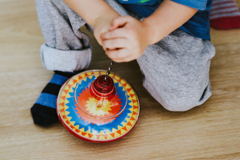 kid, real people, human hand, hand, fun, holding, people, innocence, high angle view, Child, playing, midsection, multi colored, floor, car, caucasian Ethnicity
