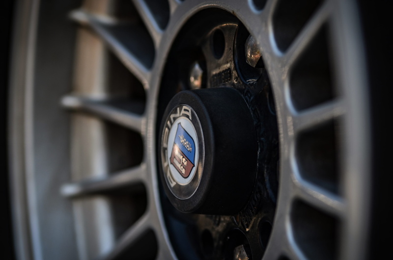 black color, metal, automotive, trademark, alpina, close-up, classic, focus on foreground, still life, symbol, mode of transportation, details, 4K, wheels