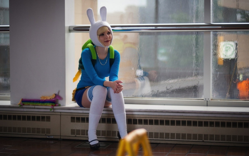 one person, window, casual clothing, day, cosplay, lifestyles, women, home interior, nerds, front view, transparent, full length, real people, sitting