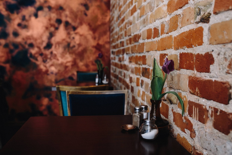 domestic room, brick Wall, home, wall - Building Feature, table, indoors, arrangement, modern, restaurant, old, rustic, built structure, container, bar