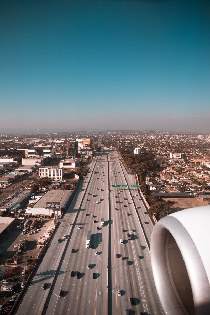 traffic, roof, 5K, downtown District, flying, travel, skyline, urban Scene, air Vehicle, scenery, sky, road, building Exterior, cityscape, highway, skyscraper