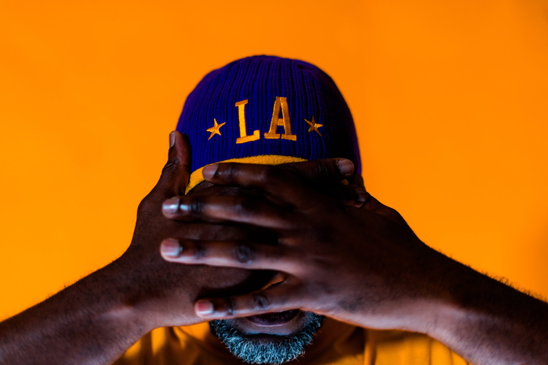 kobe bryant, hand, lonzo ball, finger, covering, colored background, yellow, men, big baller brand, communication, holding, adult, magic johnson, studio shot
