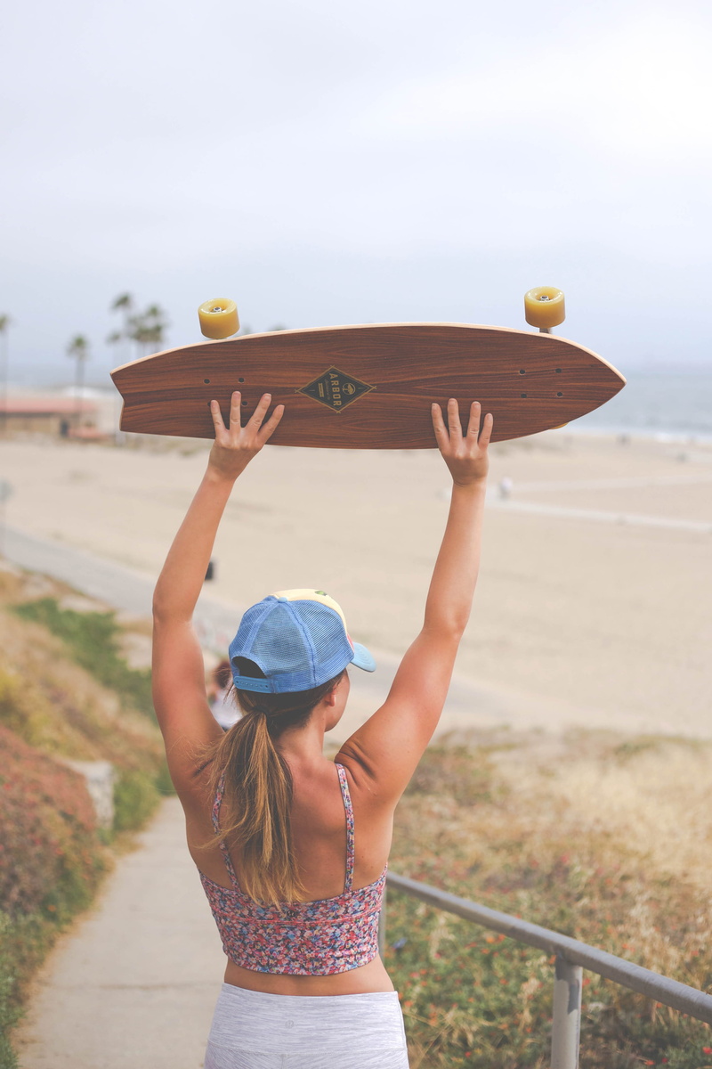 nature, woman, sea, malibu, beach, longboard, standing, skateboard, arms raised, casual clothing, real people, sky, child, californium, fun, day, fitness