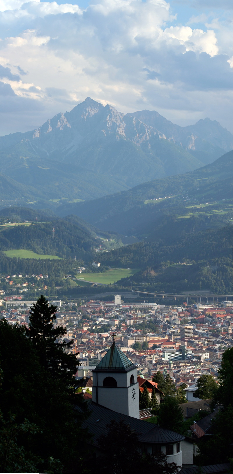 sky, mountain, mountain peak, town, no people, cityscape, building exterior, Innsbruck, built structure, looking down, high angle view, mountain range