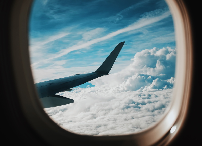 cloud, journey, above, window, travel, scenics - nature, person, nature, no people, plane, mid-air, mode of transportation, sun, beauty in nature, right