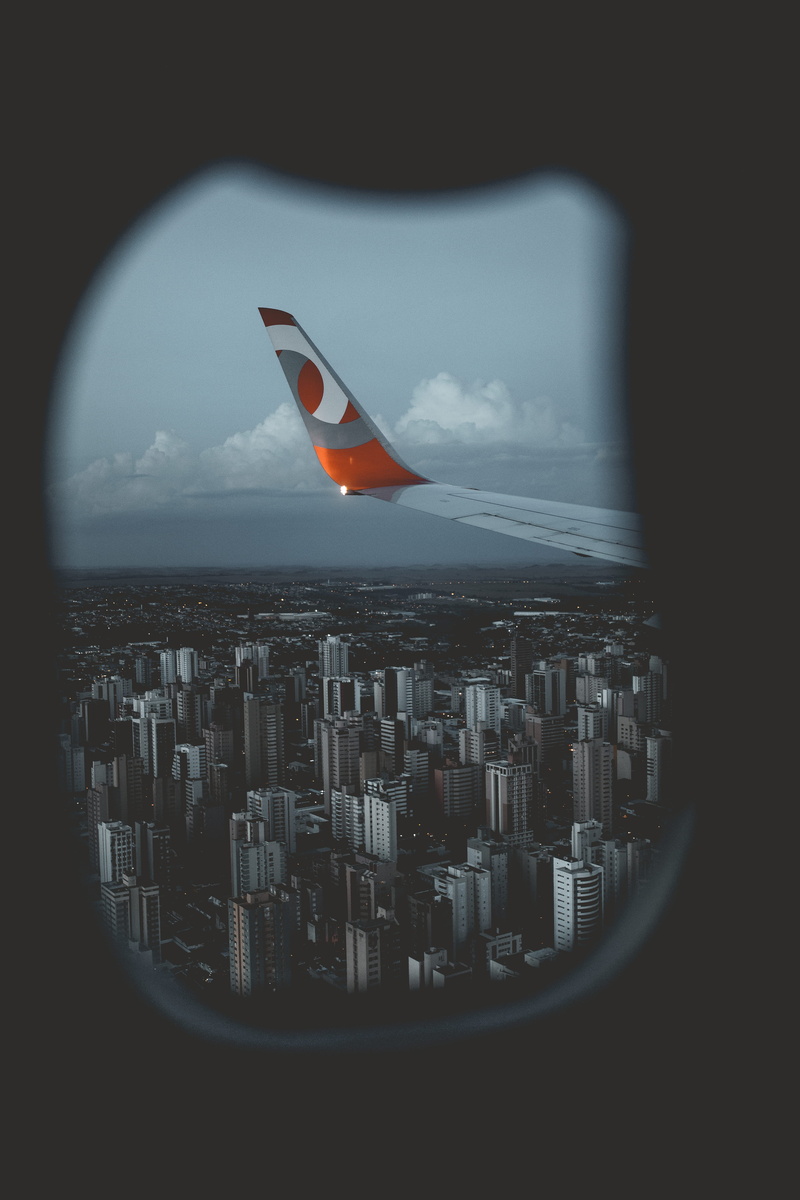 cityscape, clouds, building, air plane, window, skyscraper, flight, air vehicle, plane, aeroplane, penumbra, horizon, built structure, airplane, city view