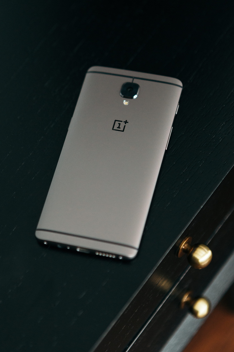 equipment, single object, no people, modern, smartphone, table, indoors, western script, close-up, communication, oneplus, high angle view, connection