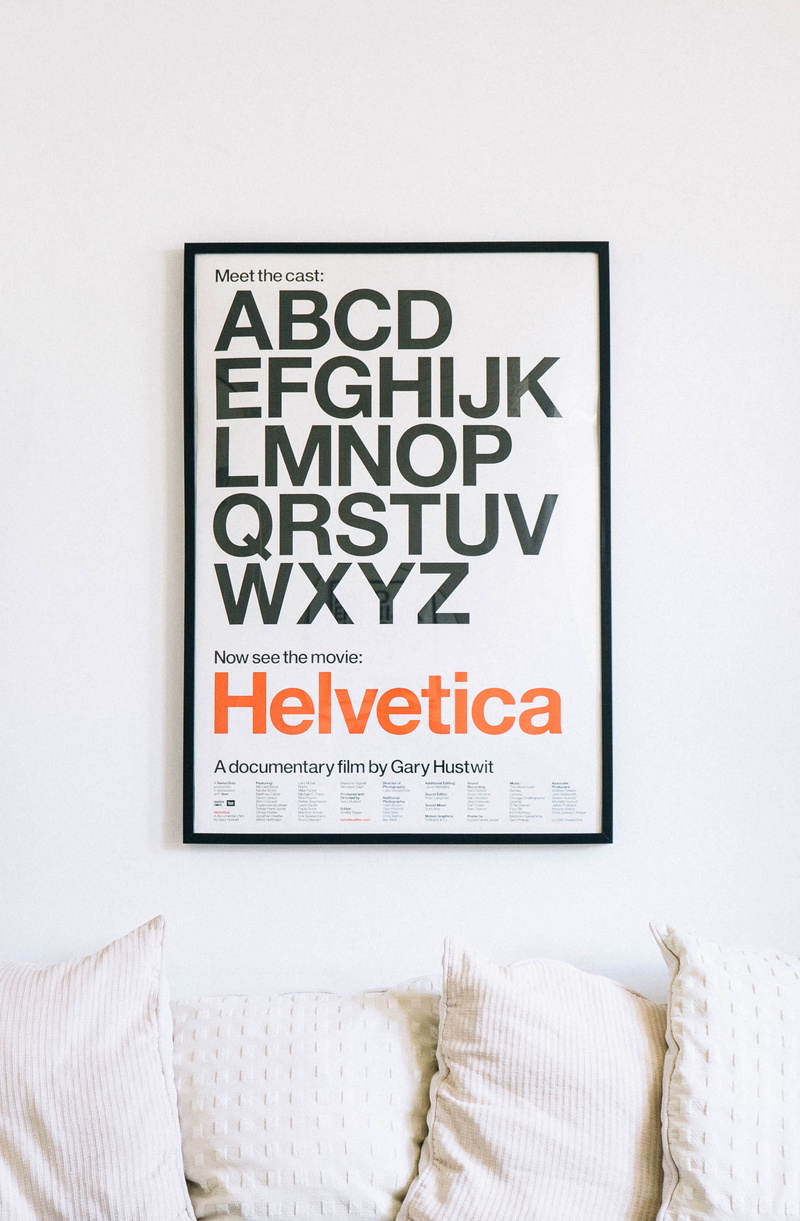 textile, text, indoors, wall, day, alphabet, sofa, bed, message, information sign, communication, furniture, stuffed, no people, close-up, sign, poster