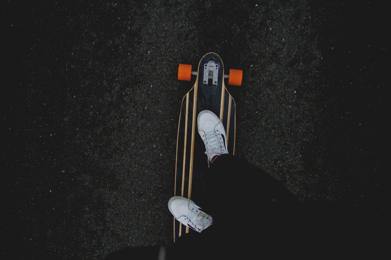 longboard, low section, skateboarding, transportation, legs, men, street, beige, city, black, lifestyles, high angle view, unrecognizable person, directly above