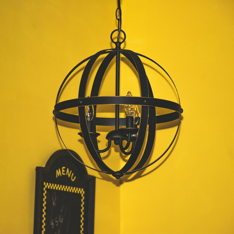 design, symbol, studio shot, style, antique, hanging, illuminated, pendant, ancient, black, yellow, disjunct, retro, bright, architecture, decor, 4K, low angle view