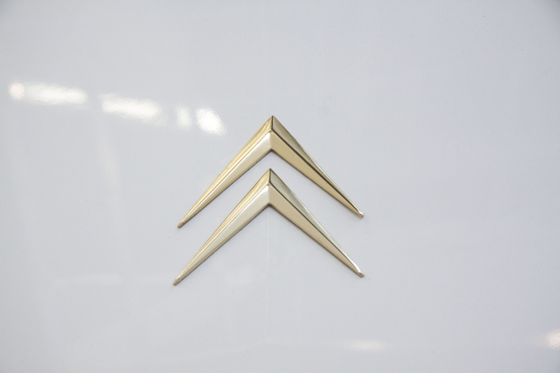table, no people, Automotive, wood - material, indoors, Citroën, logo, Ds 21, simplicity, still life, high angle view, paper, communication, music, business