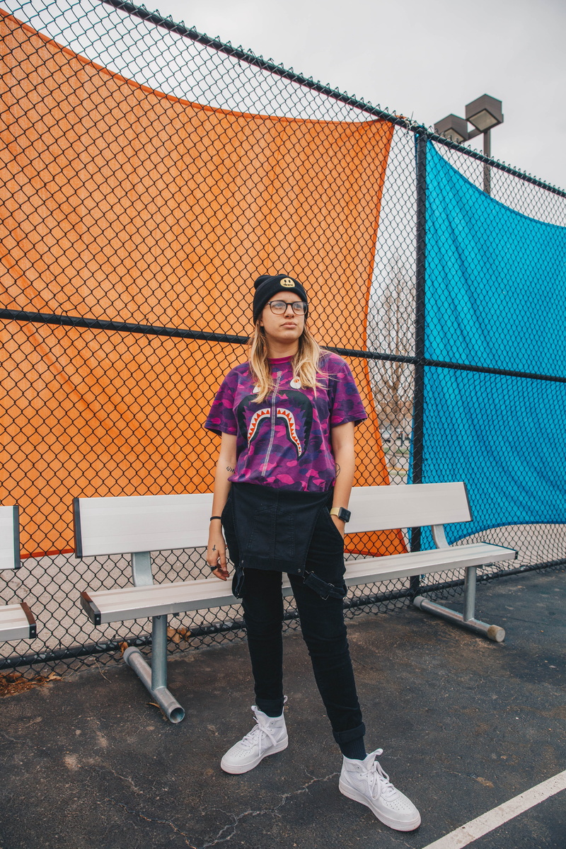 full length, clothing, wearing, communication, casual clothing, one person, shirt, pants, wireless technology, fitted, fence, technology, near, bape, beautiful woman