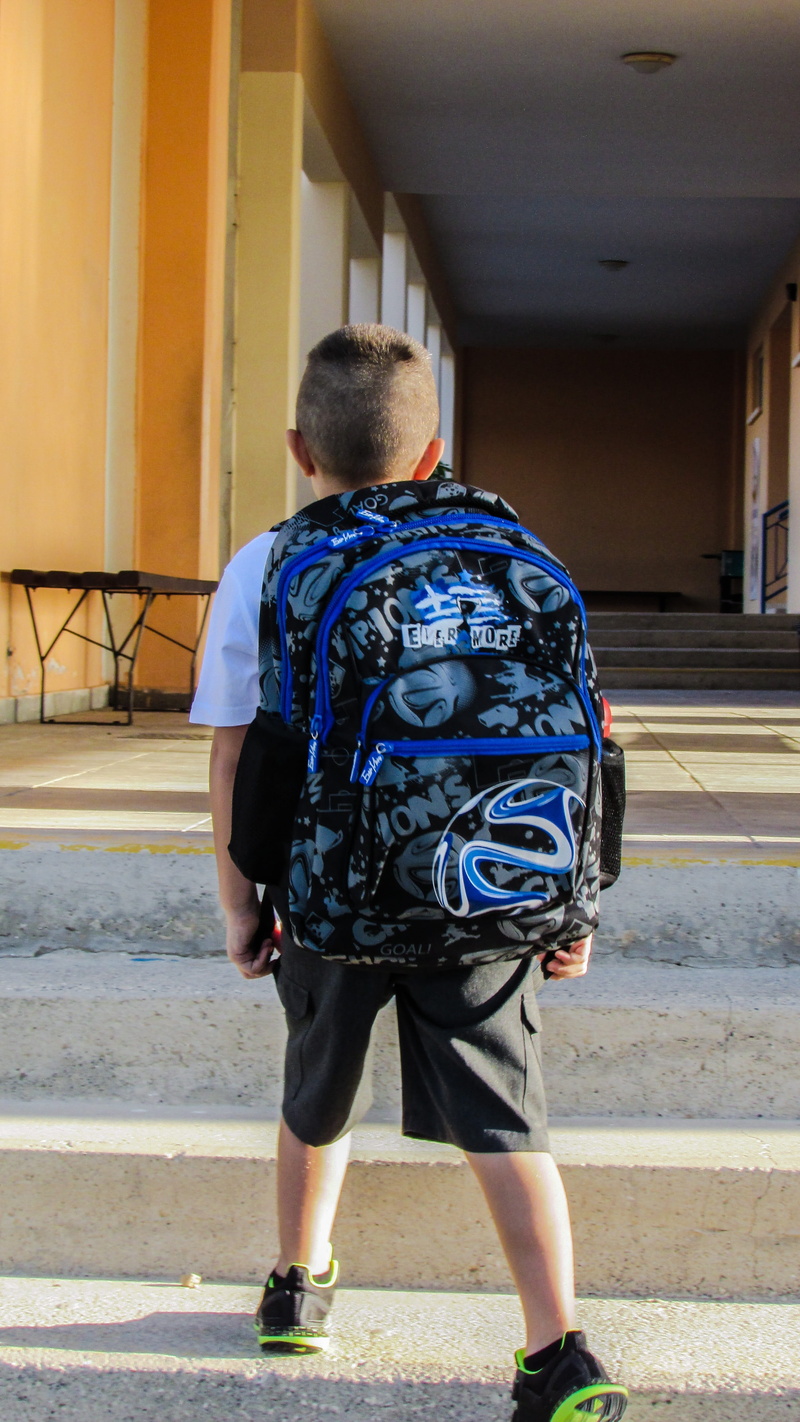 rear view, standing, architecture, first steps, lifestyles, full length, casual clothing, school bag, boys, men, leisure activity, built structure, city