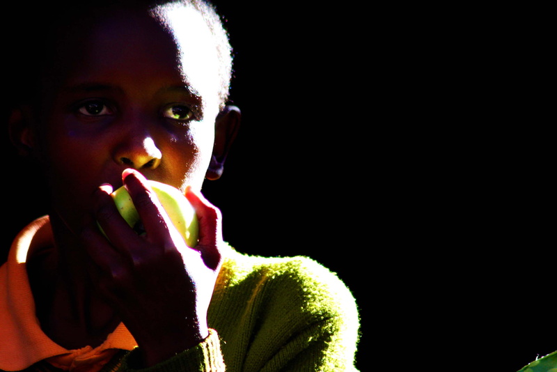 healthy eating, dark, darkness, kiunga, uganda, human face, portrait, apple, close-up, school, holding, front view, hairstyle, indoors, looking at camera