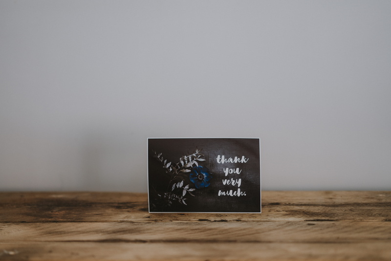 indoors, wood - material, gray, thank, quotes, wooden table, design, computer, post card, wireless technology, accessibility, message, connection, card