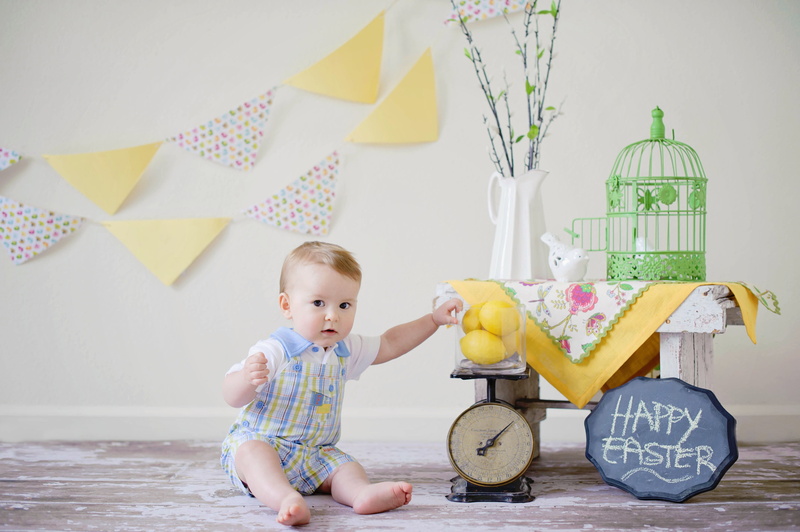 lifestyles, happiness, toddler, beside, wearing, table, real people, text, rompers, Toy, happy, day, one Person, kid, boys, innocence, cheerful, adorable