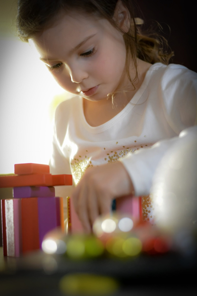casual clothing, looking down, headshot, looking, females, hairstyle, pre-adolescent child, children, concentration, real people, selective focus, think