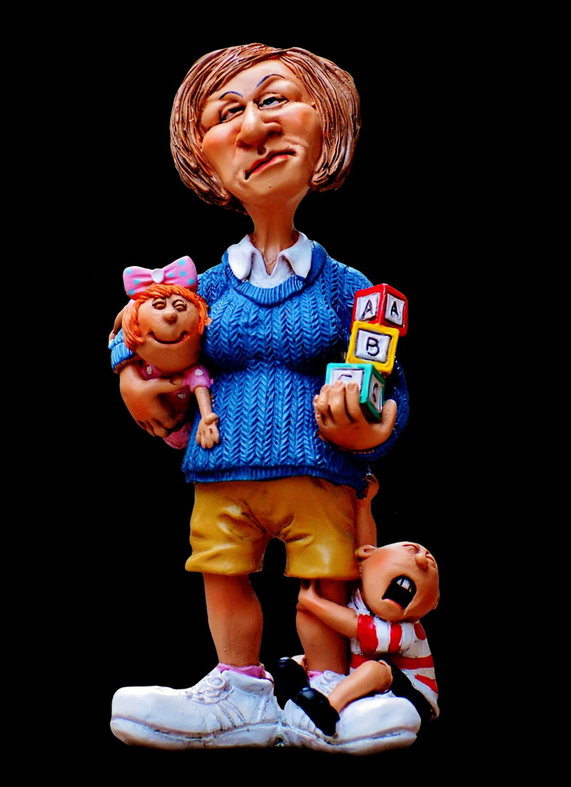 holding, male likeness, nanny, innocence, creativity, black background, studio shot, indoors, kindergarten teacher, children, funny, cute, baby-sitter