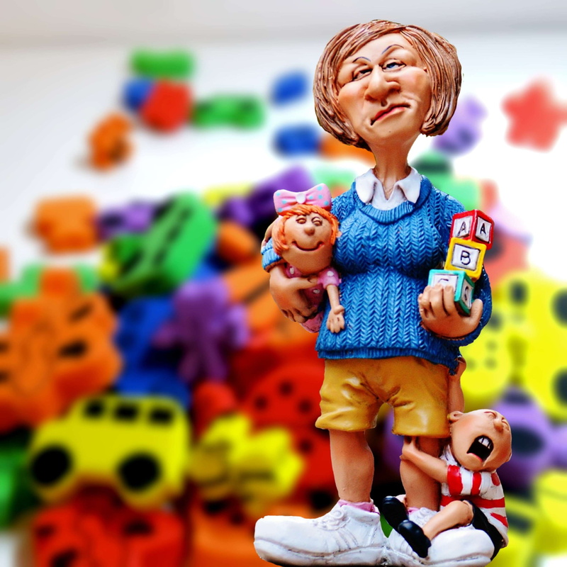 play, creativity, emotion, blue, craft, figurine, multi colored, blond hair, children educator, kindergarten teacher, front view, children, building blocks