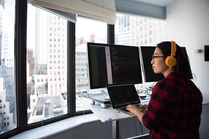 coder, desk, programmer, computer equipment, laptop, office, computer monitor, daylight, computer, waist up, 5K, workspace, using computer, work, adult
