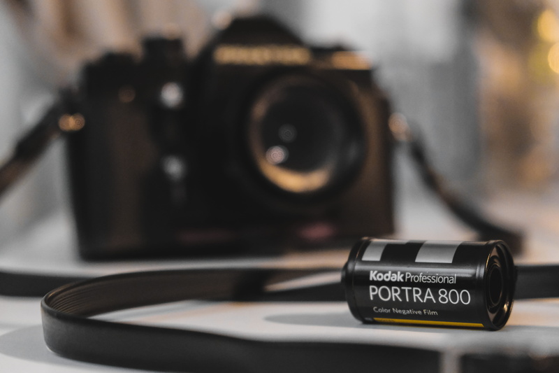 wheel, photographic equipment, slr camera, cosmetics, black color, kodak, text, symbol, video camera, single object, gps, focus on foreground, stereo, indoors