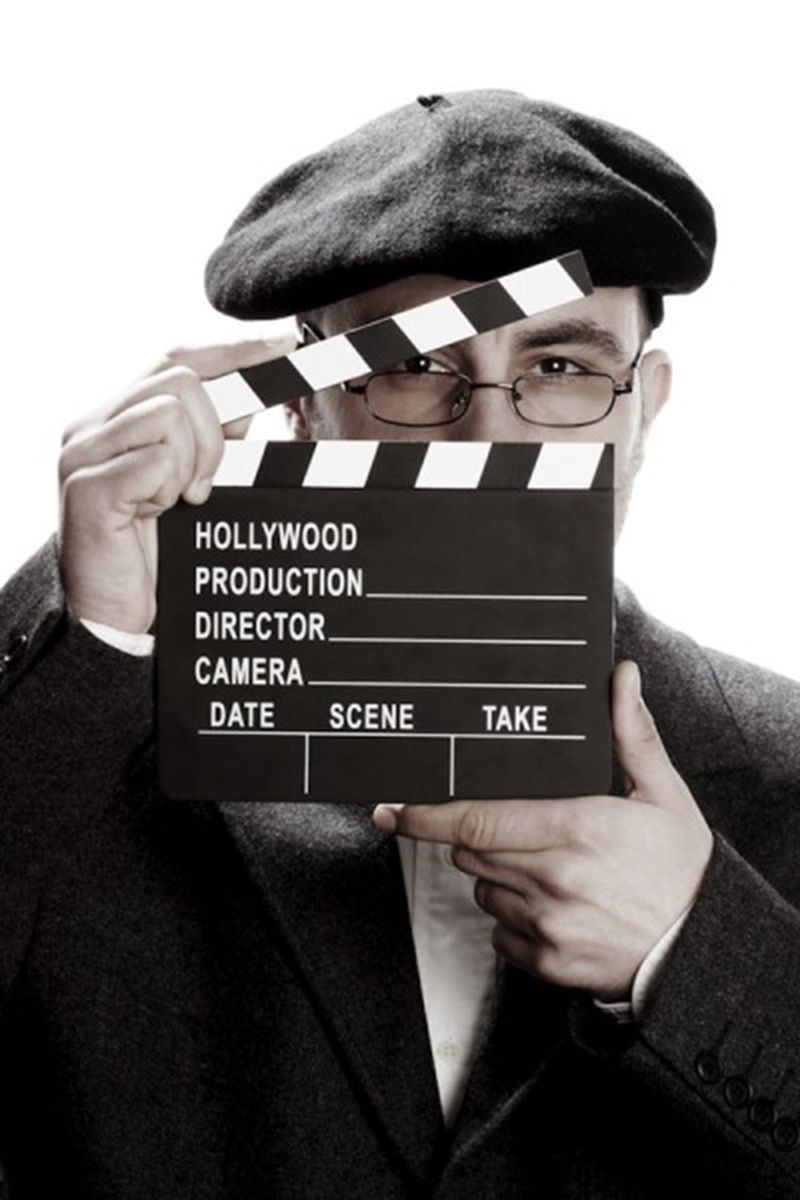 arts culture and entertainment, text, headshot, glasses, adult, film industry, television camera, black, holding, s, studio shot, one person, camera operator