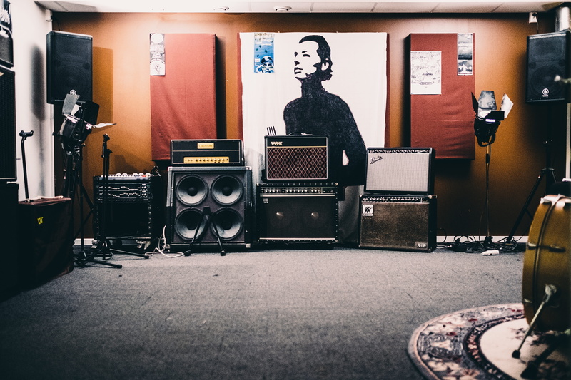 art and craft, inside, communication, seat, guitar, indoors, 5K, equipment, band, picture frame, tech, amplifier, technology, furniture, sitting, musical equipment