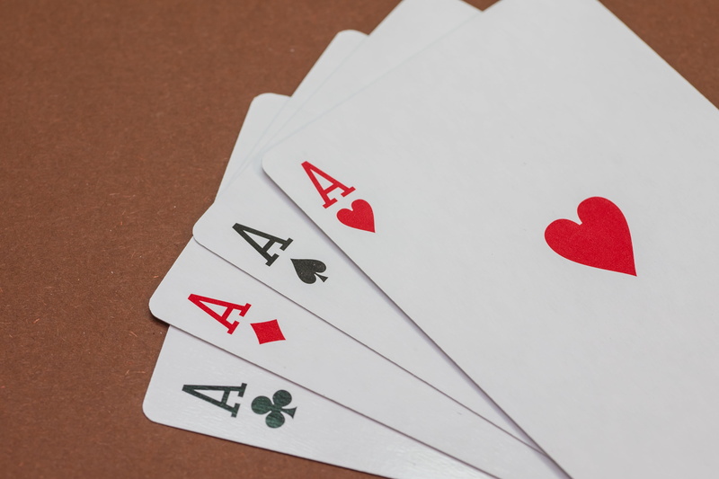 brown, indoors, play, positive emotion, leisure activity, playing cards, poker, win, high angle view, poker - card game, card game, luck, still life, gambling