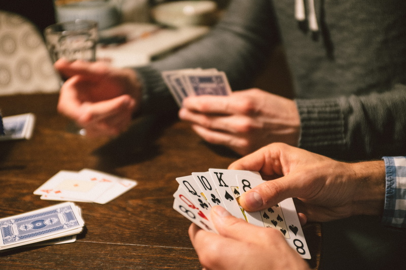 playing Cards, poker - Card Game, gambling, leisure activity, card game, lifestyles, men, arts culture and entertainment, luck, holding, relaxation, table