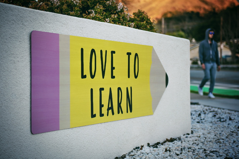 text, walking, united states, near, love, message, human, street, san luis obispo, footwear, signage, information, information sign, person, words, learn