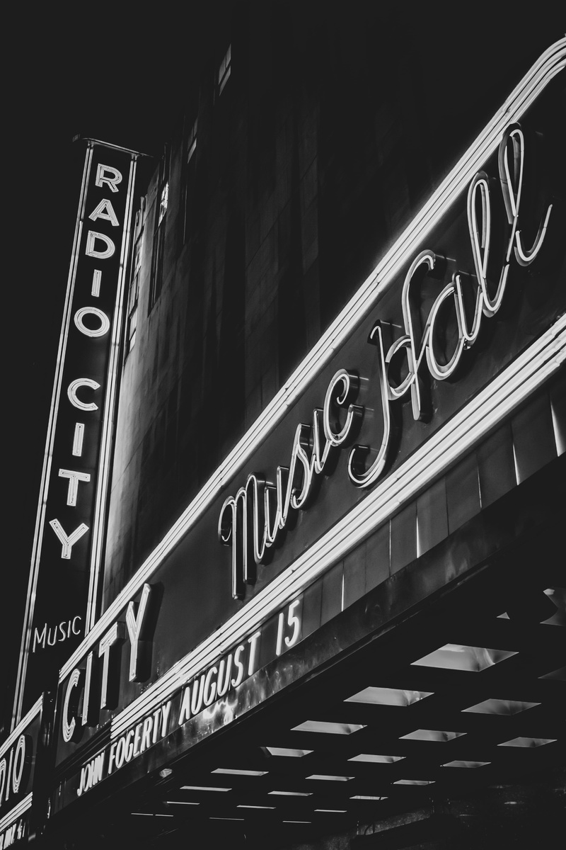 architecture, iconic, new york, classic, western script, low angle view, built structure, black and white, neon sign, united states, radio city, word, vintage