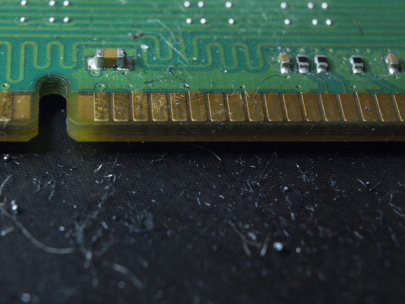 connection, ram, indoors, close-up, text, mother board, device, green color, computer chip, computer part, wood - material, circuit board, technology, table