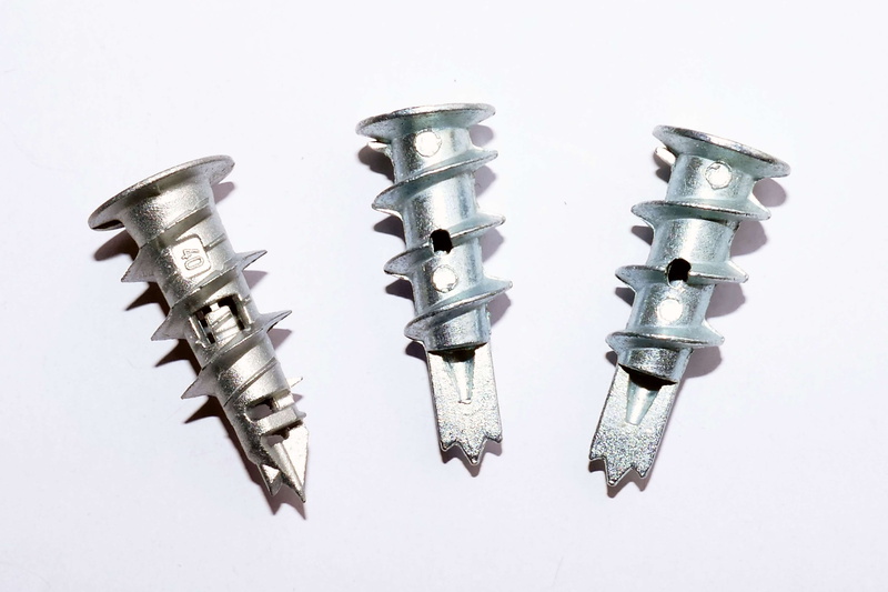 two objects, raw plugs, indoors, industry, no people, equipment, black color, 4K, building, plaster plugs, sharp, three objects, wall fixings, white background