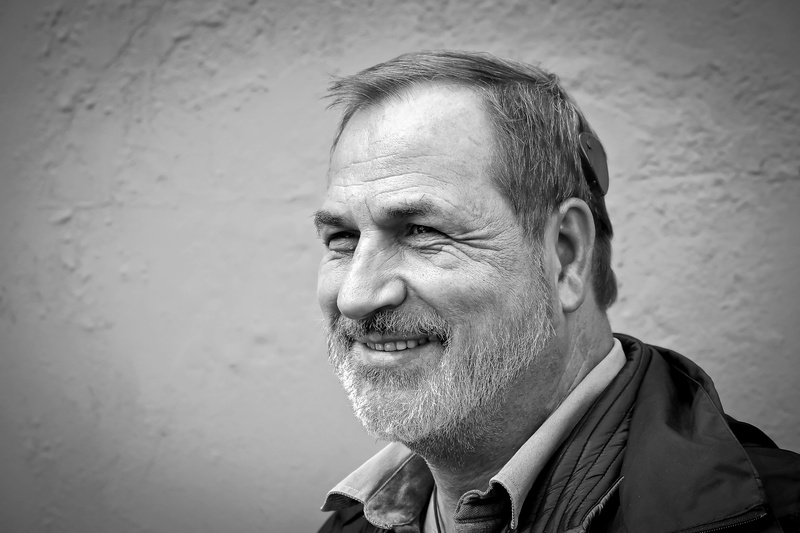 wrinkled, lifestyles, men, close, smiling, smile, facial hair, black white, face, bart, head, contemplation, photo, speech processor, hearing aid, expression