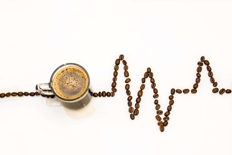 western script, caffeine, no people, coffee foam, connection, drink, ecg curves, 4K, single word, text, still life, coffee drink, studio shot, white background