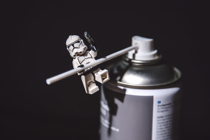 label, lego, display, can, two objects, design, social issues, indoors, security, no people, wars, close-up, artistic, white, communication, composition