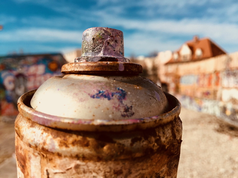 cylinder, environment, pressure vessel, building exterior, pollution, city, color box, close-up, container, metal, land, built structure, street art, no people