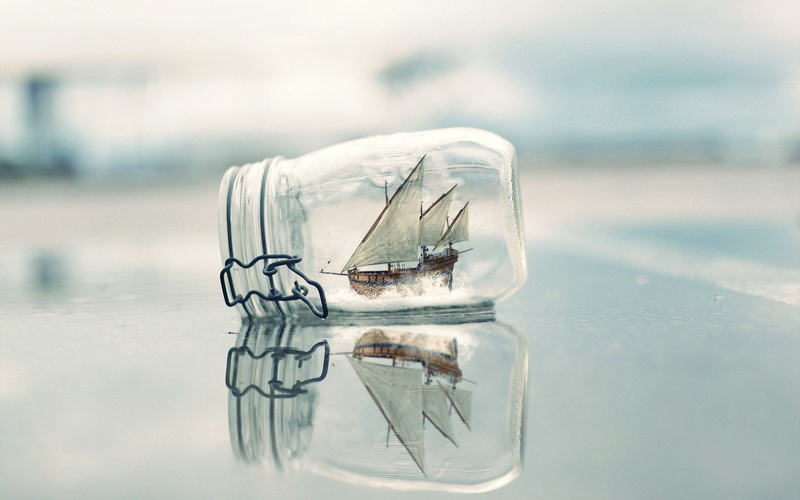 no people, symmetry, outdoors, close-up, focus on foreground, day, ship, still life, selective focus, bottles, frozen, floating on water, single object