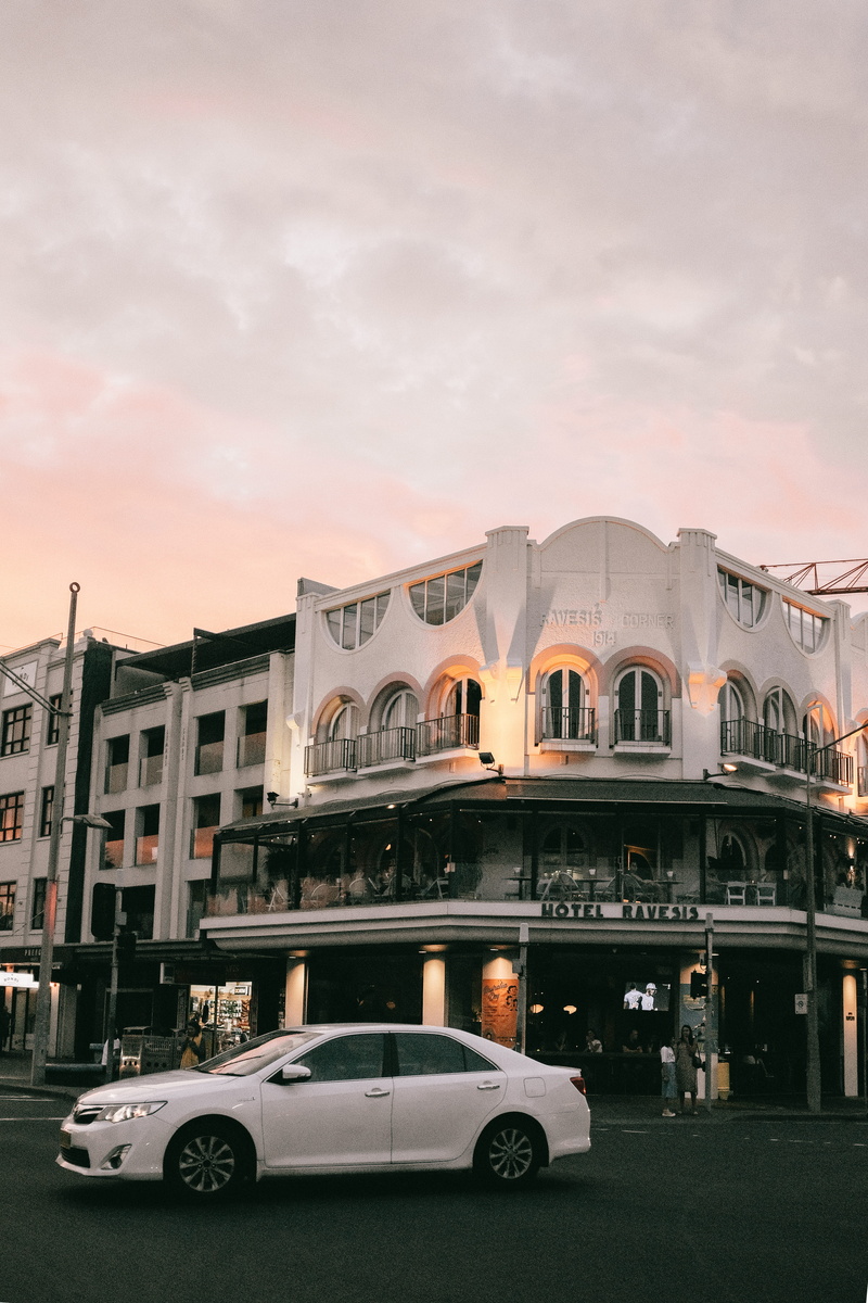 transportation system, motor vehicle, landmark, hotel, road, landscape, on the move, street, camry, urban, automobile, transportation, golden hour, outdoors