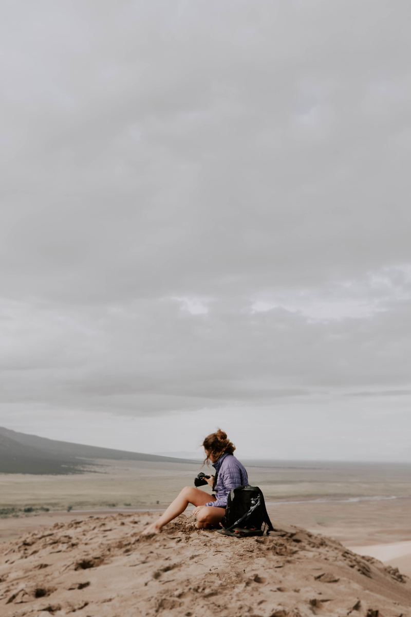 sitting, sand, sand dune, lifestyles, explore, outdoors, beach, adventure, nature, woman, scenics - nature, solitude, friend, 5K, land, non-urban scene