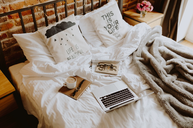 interior, apartment, indoors, loft, bedroom, bed office, technology, event, no people, still life, high angle view, brick wall, coffee, laptop, morning