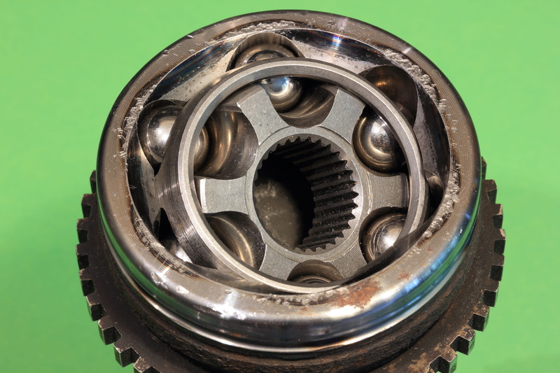 no people, directly above, constant, automotive, wheel, homokinetic, single object, black color, shape, indoors, can, pattern, housing, driveshaft, cut out