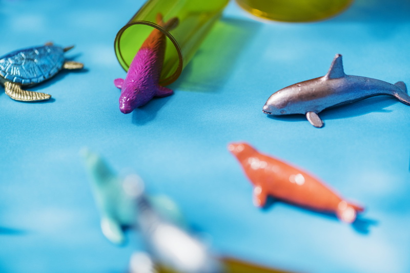 selective focus, model, abstract, indoors, toy, symbol, vertebrate, group of animals, blue, animal wildlife, green, background, neon, beauty in nature