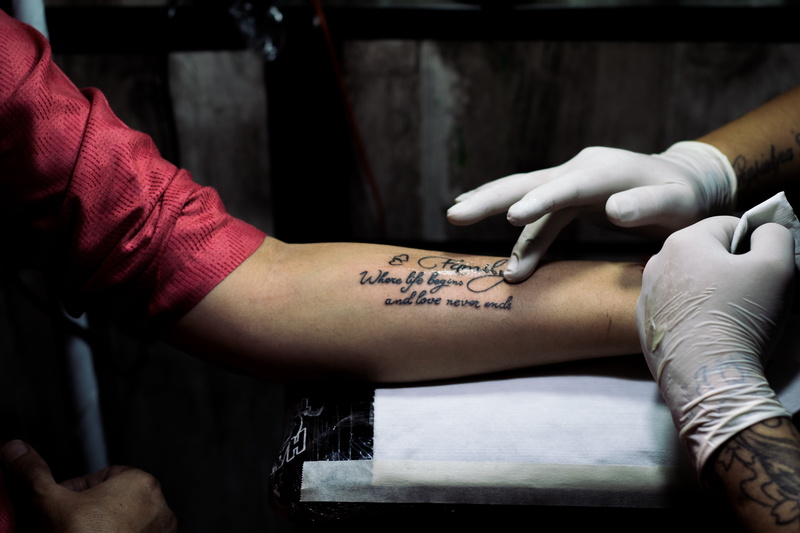 symbol, adults only, indoors, quotes, human arm, midsection, tattoo, arm, tattooing, rose, decorative, retro, left, writing, occupation, men, ink, vintage