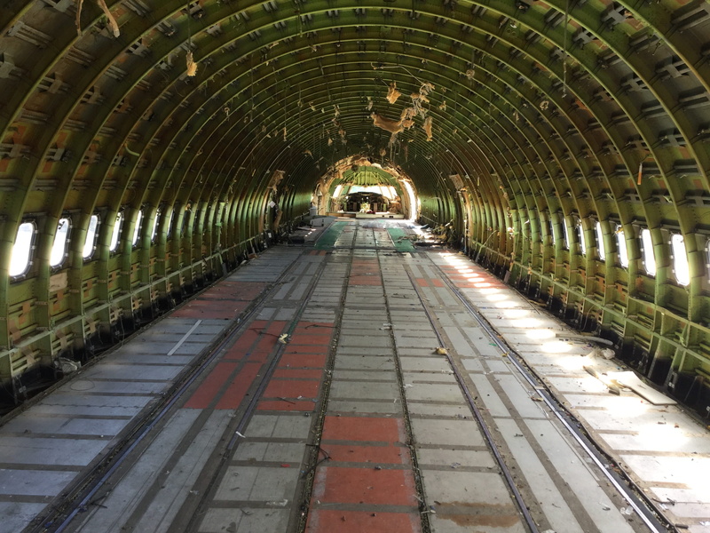 mode of transportation, day, illuminated, railroad track, quirky glamping, plane, Quirky, 2K, the way forward, architecture, vanishing point, no people