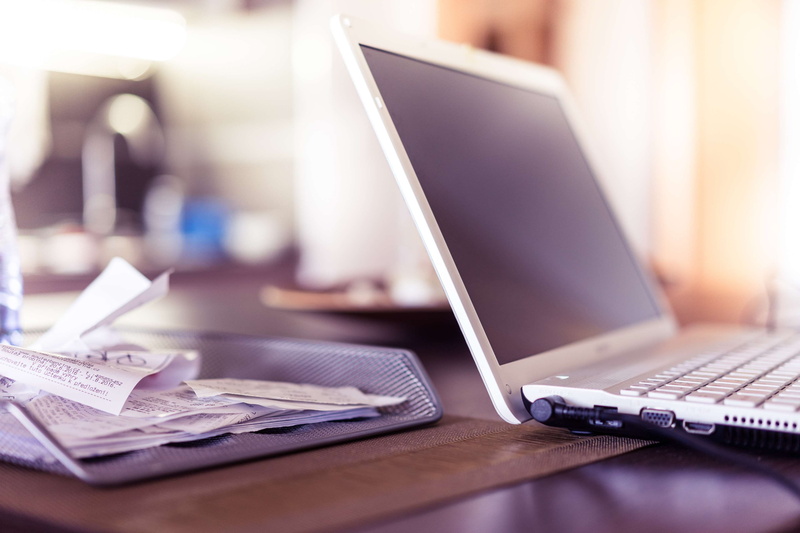 indoors, wireless technology, selective focus, furniture, working at home, business finance and industry, using laptop, portability, finance, technology
