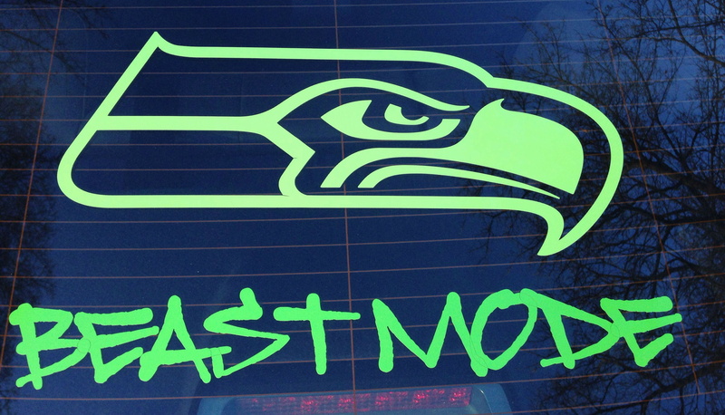 western script, wall - building feature, wall, green color, architecture, built structure, information, plant, no people, seattle, football, graffiti, day