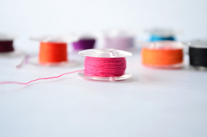 selective focus, healthcare and medicine, group, research, yarn, copy space, in a row, red, variation, white background, studio shot, indoors, 4K, cotton