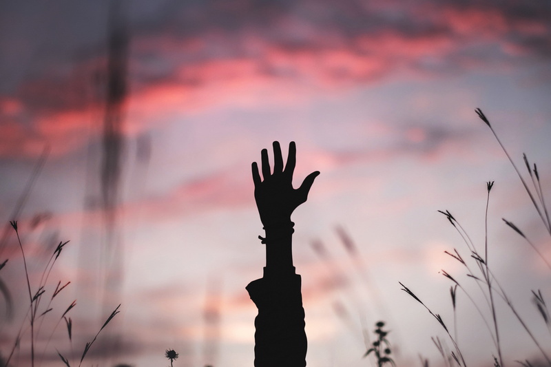 cloud, hand, dramatic sky, bracelet, hand raised, beauty in nature, human body part, one person, nature, scenics - nature, human hand, grasp, raising, field