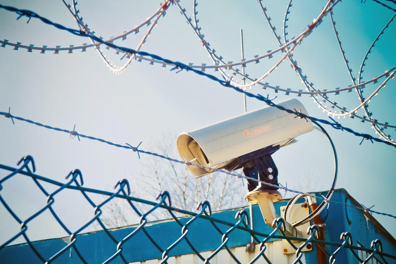 no people, refugees, camera, watch, safety, Barbed Wire, observation, fence, supervision, low angle view, wire, lack of dom, white, daytime, privacy, accommodation